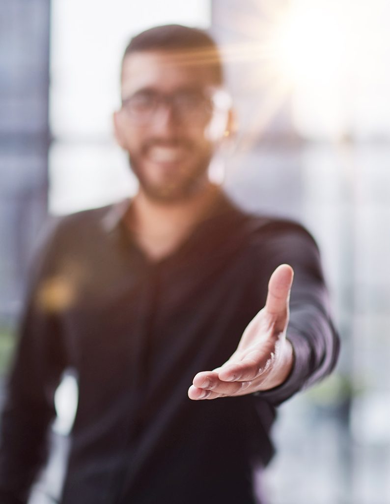 Infopro Digital Automotive team member welcoming a new customer