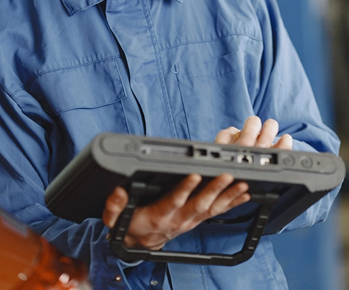 Mechanic using a diagnostic tool