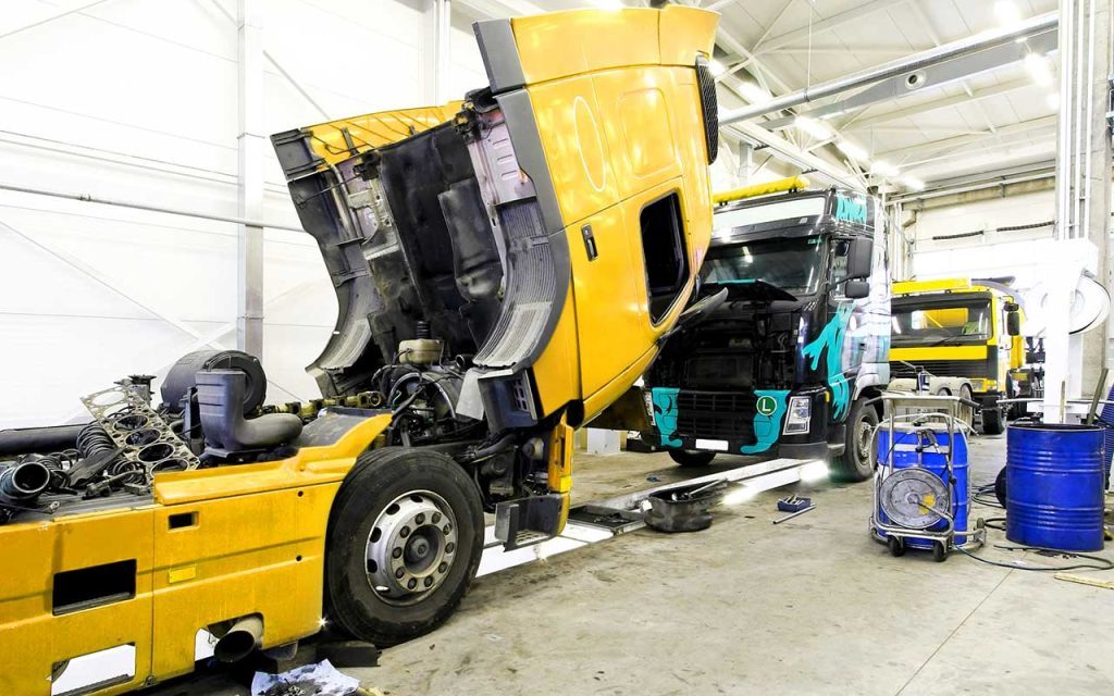 Trucks in the repair shop waiting to be repaired with e3technical data help