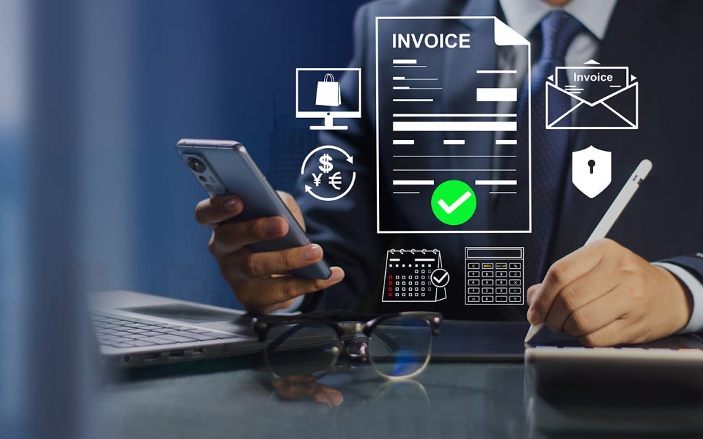 Homme réalisant sa facturation en conformité avec la législation sur la facturation électronique grâce aux outils de gestion, ERP et DMS Infopro Digital Automotive