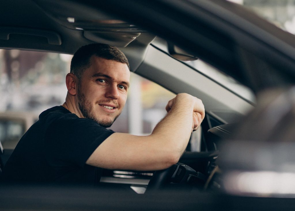 man driving his own car 