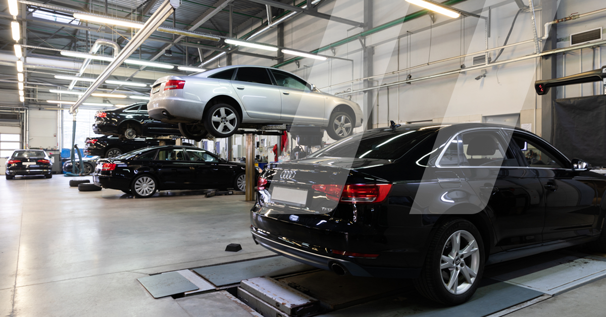 Overview of car repair workshop representing the automotive aftermarket industry