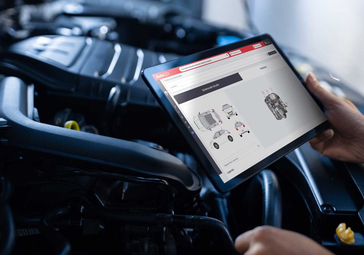 Mechanic with tablet consulting Technical Data and Vehicle Repair and Maintenance Informations