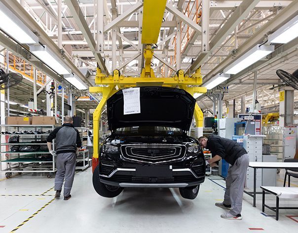 people working in a car factory representing a type of infopro digital automive customers