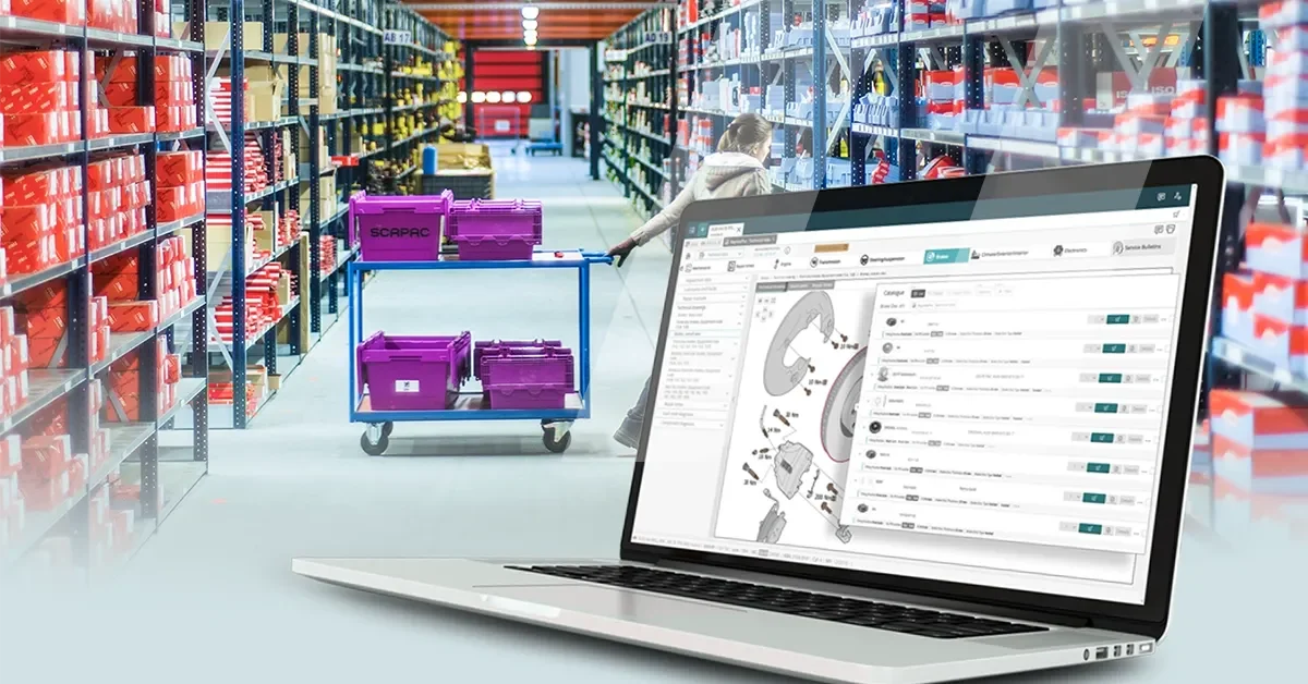 Computer with a spare parts catalogue integrating haynespro's technical data with the background of a spare parts warehouse