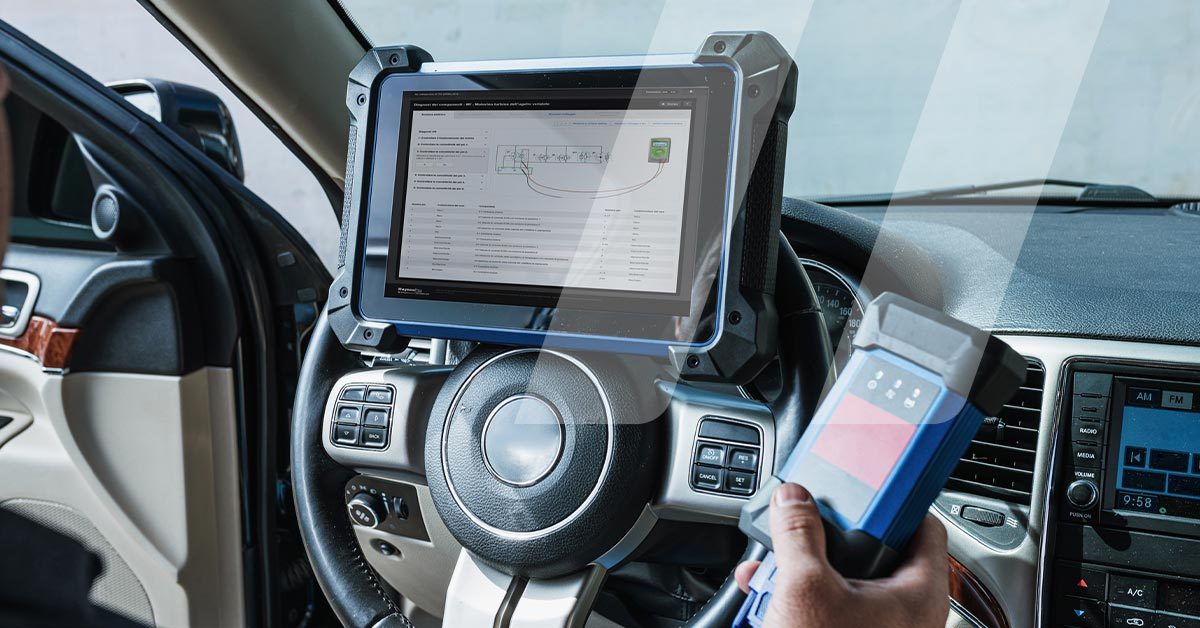 Garage owner driving a vehicle to carry out a diagnosis using a tool that utilises HaynesPro data