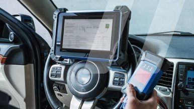 Garage owner driving a vehicle to carry out a diagnosis using a tool that utilises HaynesPro data